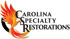 A black and white logo for carolina specialty restoration.