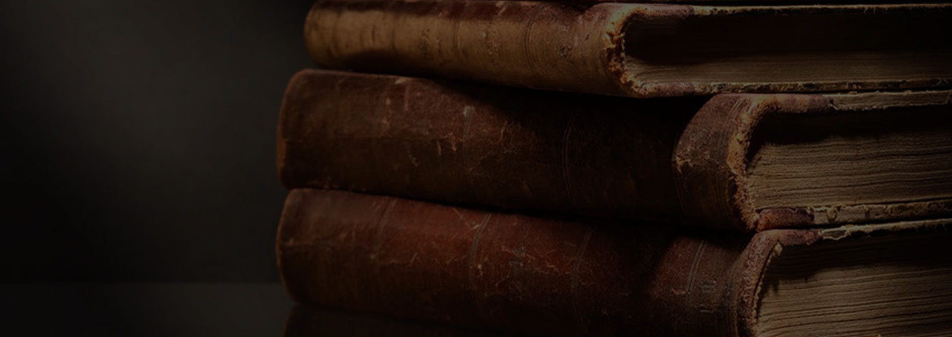 A close up of some cigars in the dark