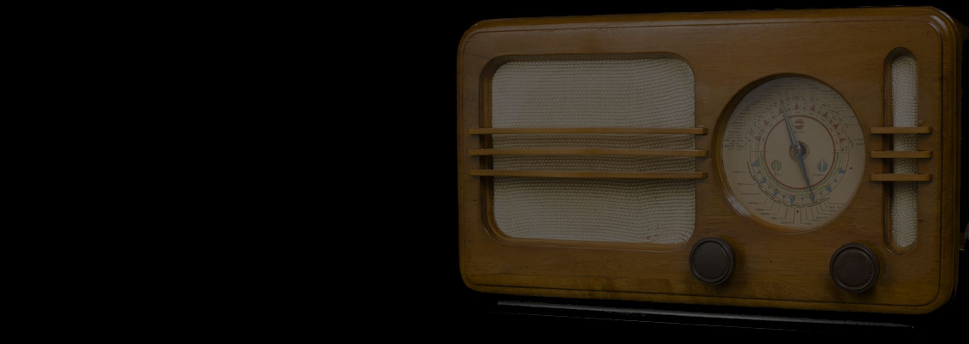 A brown and white television set on a black background