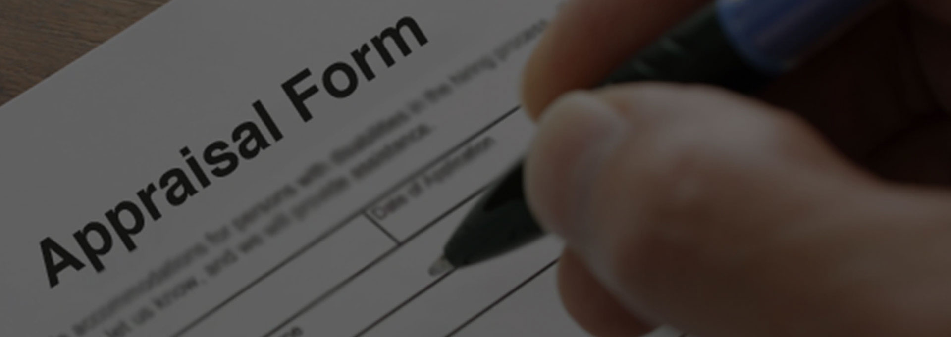 A person is filling out an application form.