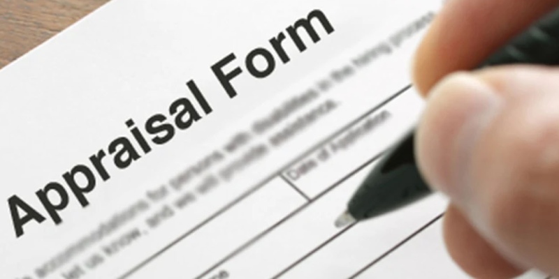 A person filling out an application form.